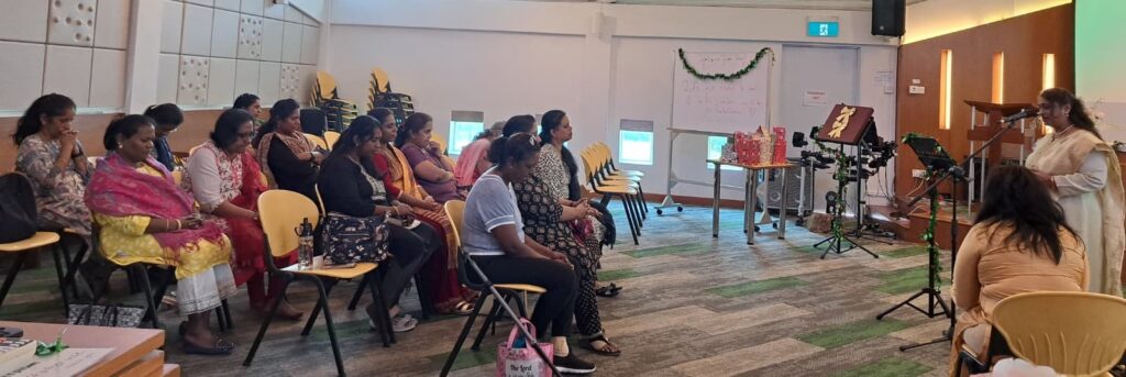 Women of the SJSM Tamil congregation in Dover participating in a fellowship session.