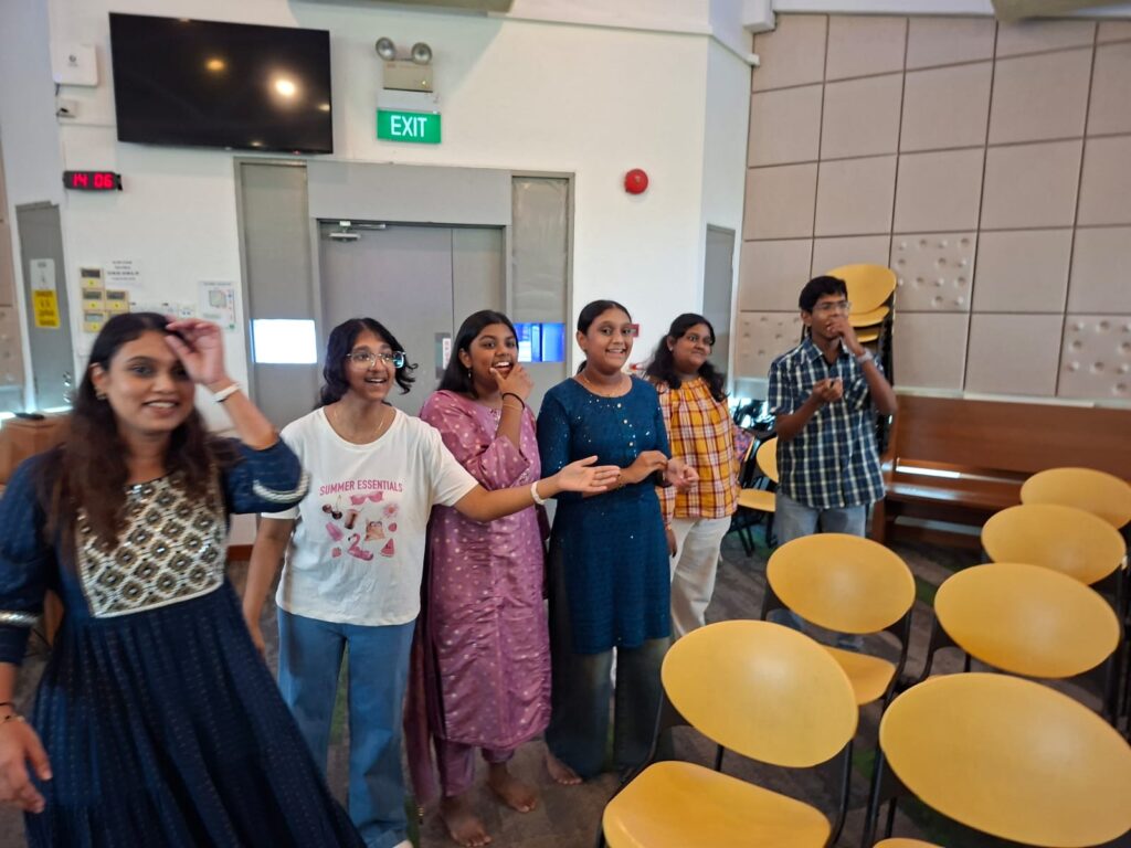 Tamil youth group members playing fun team-building games.